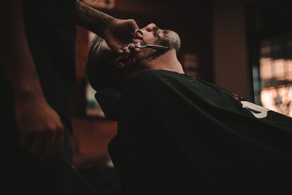 Barber giving a straight razor shave